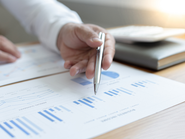 Person Analyzing Chart